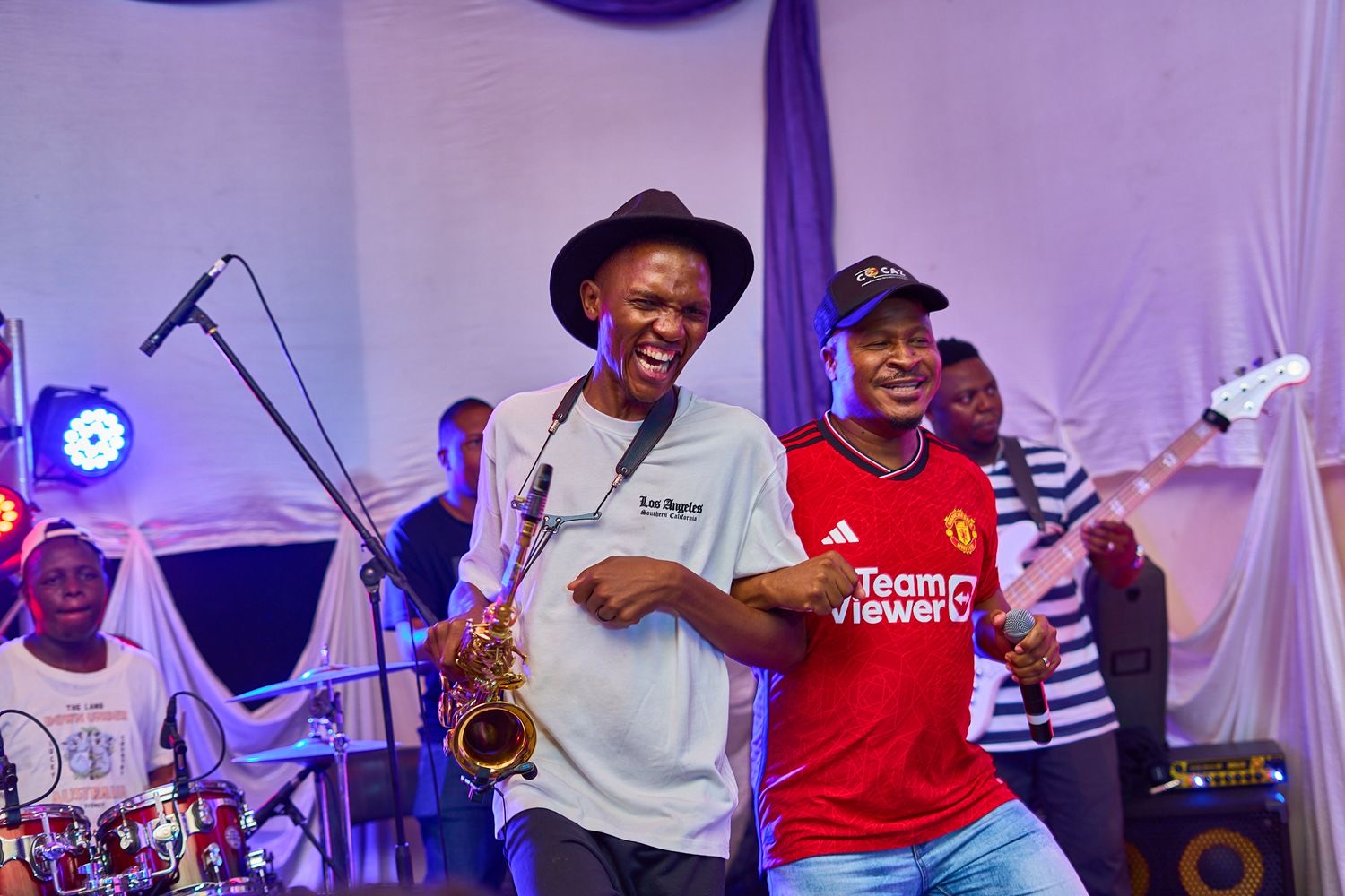 Performers on an outdoor stage, shot by Simply Art Creative